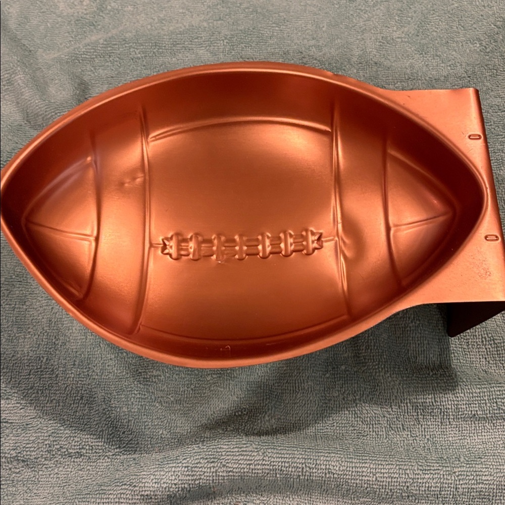 Wilton aluminum football baking mould.